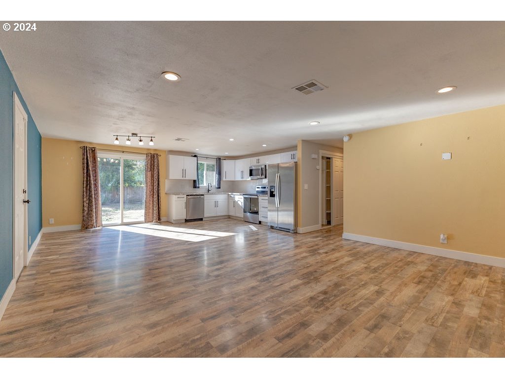 2102 Delta Street Eugene, OR 97404 - Photo 6 of 35 a view of empty room with wooden floor