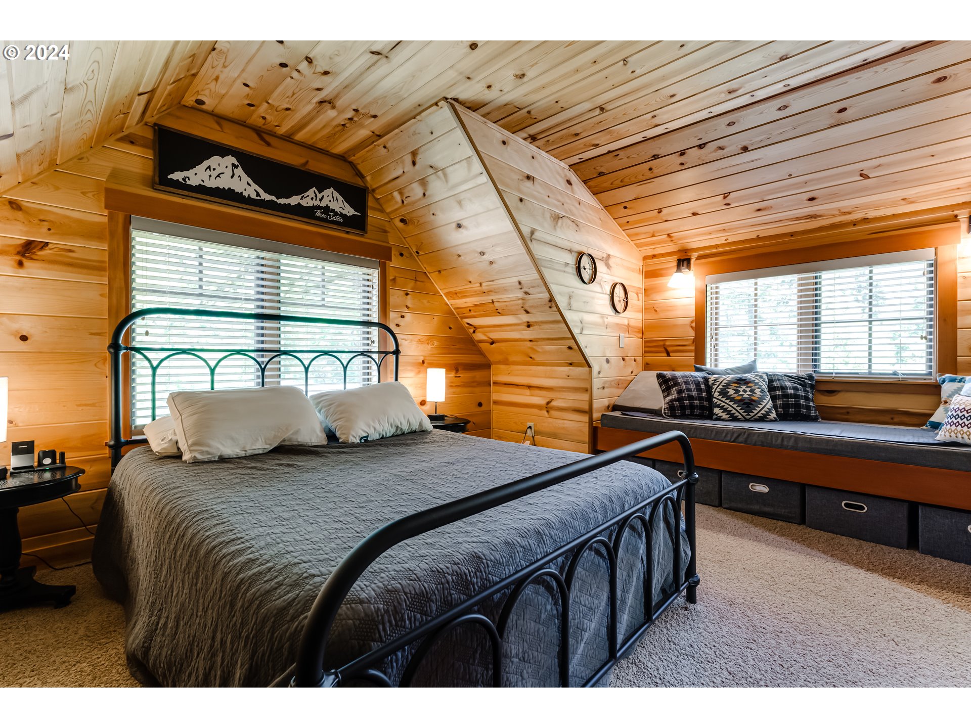56483 McKenzie Highway Blue River, OR 97413 - Photo 22 of 38 a bedroom with a bed and a large window with the outer view