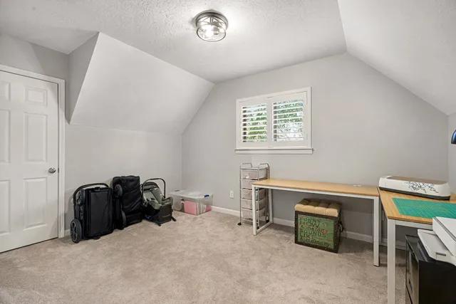 a view of workspace with furniture and window