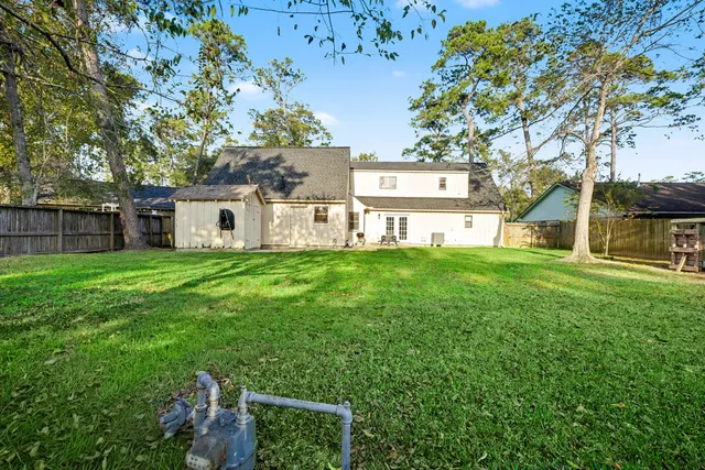 a view of a house with a yard porch and sitting area