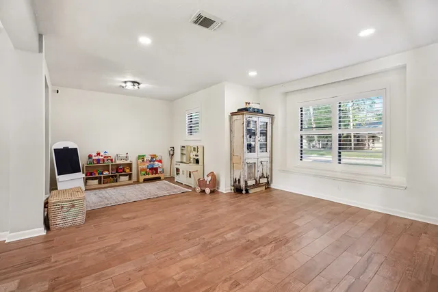 a view of a livingroom with furniture and a flat screen tv