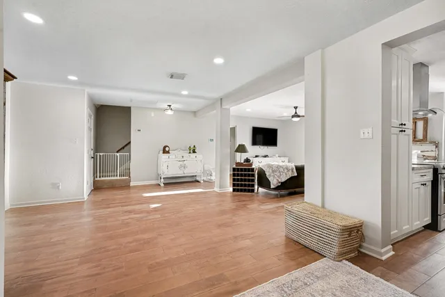 a view of a livingroom with workspace and a window