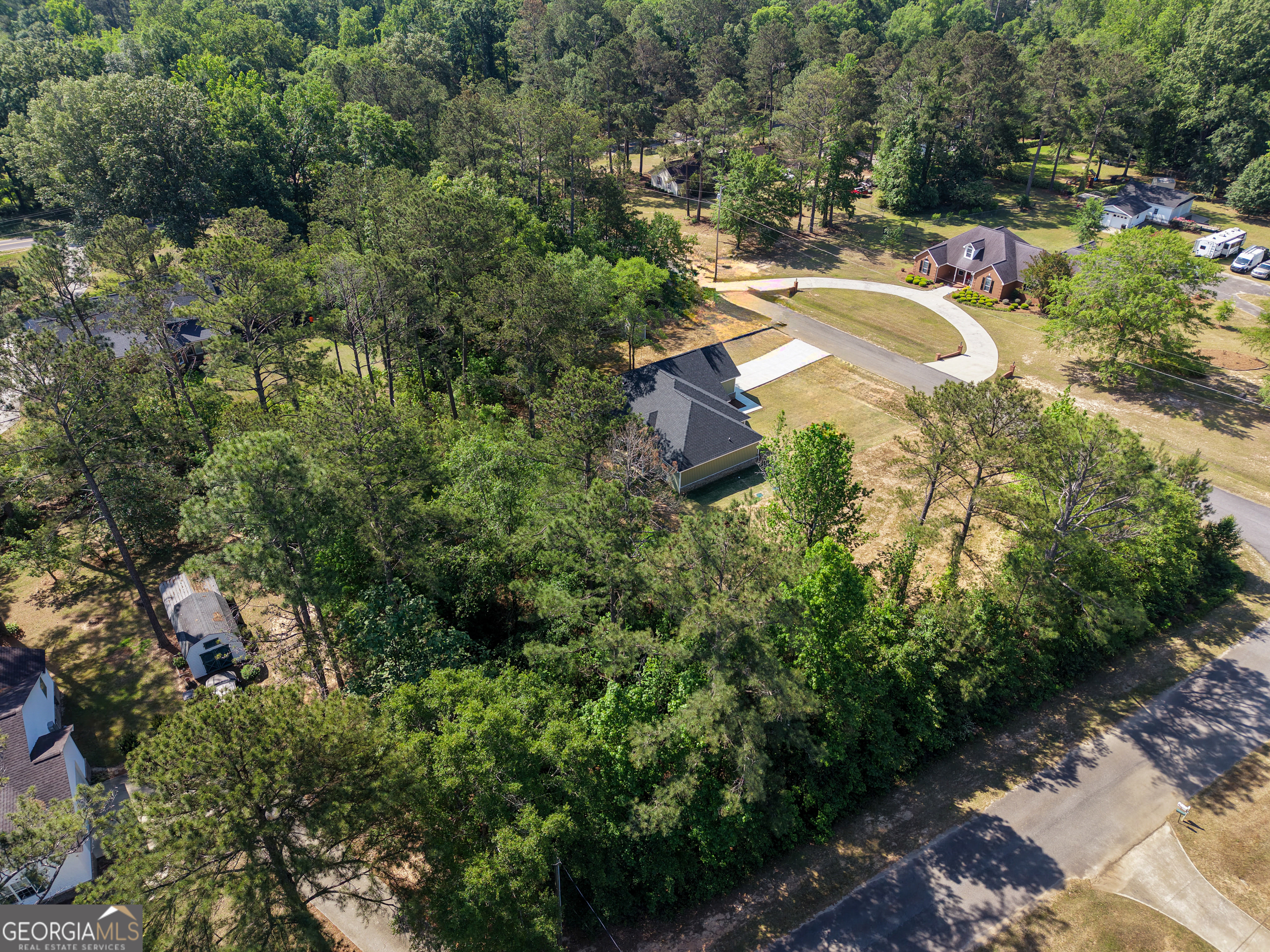 711 Flanders Lane Dublin, GA 31021 - Photo 49 of 49 an aerial view of residential house with outdoor space and trees all around