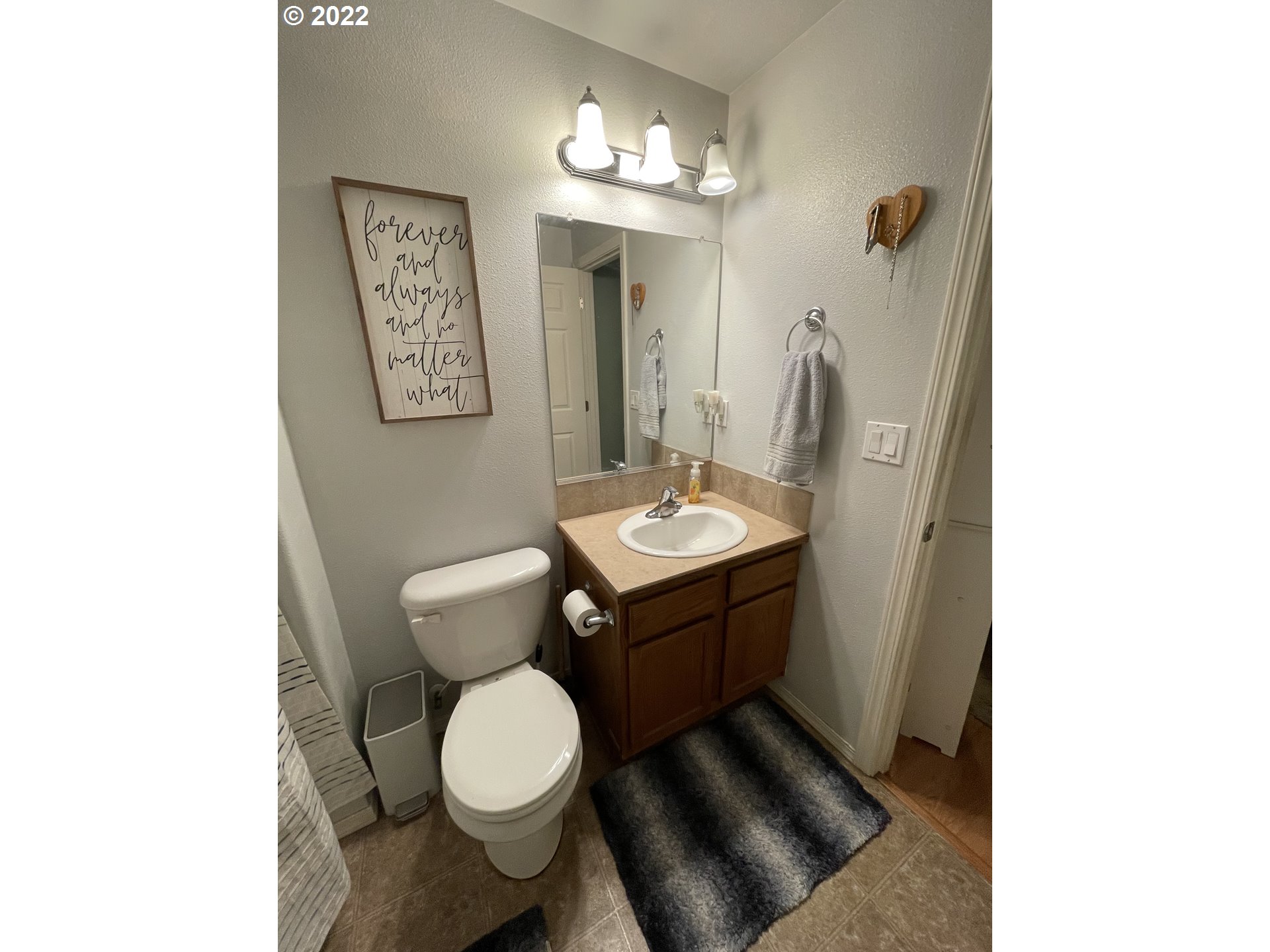 5785 Pumice Place Springfield, OR 97478 - Photo 27 of 31 a bathroom with a toilet sink and mirror