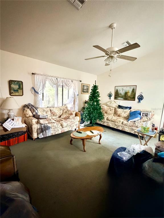 14030 Hexam Road Brooksville, FL 34613 - Photo 5 of 18 a living room with furniture and a flat screen tv