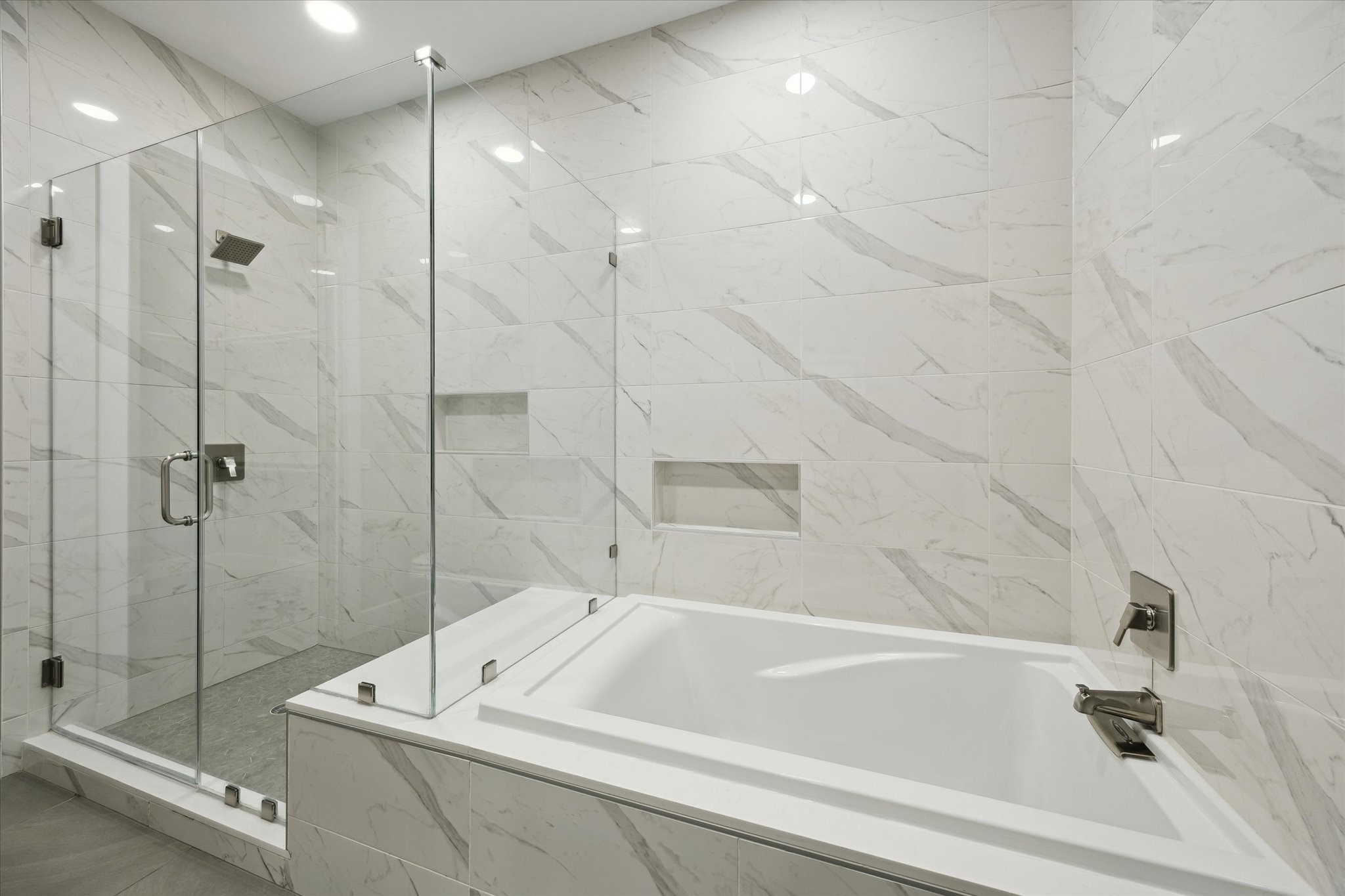 9757 Katy Freeway, Unit 822 Houston, TX 77024 - Photo 13 of 30 a bathroom with a tub and a shower