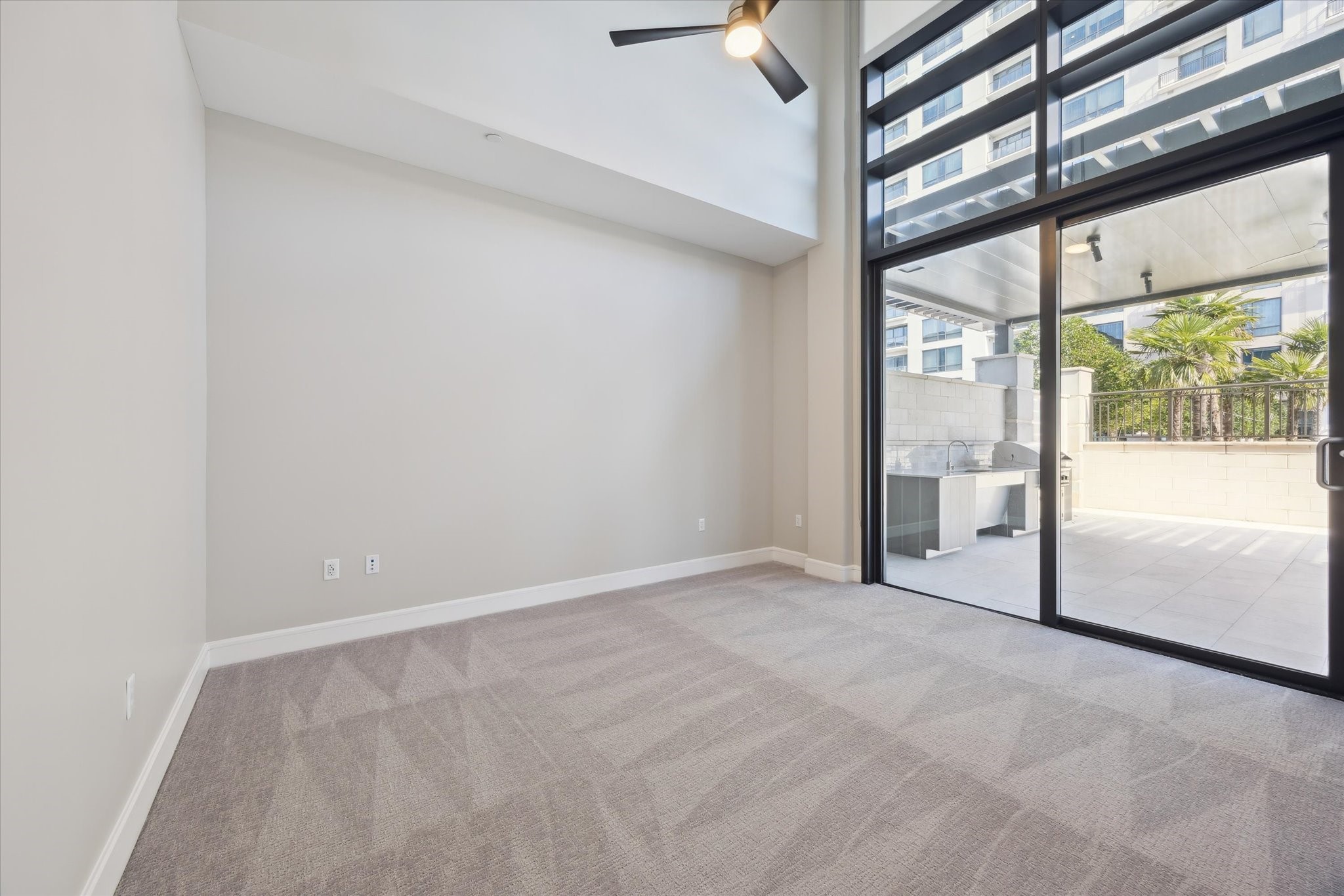 9757 Katy Freeway, Unit 822 Houston, TX 77024 - Photo 14 of 30 a view of empty room with floor to ceiling window