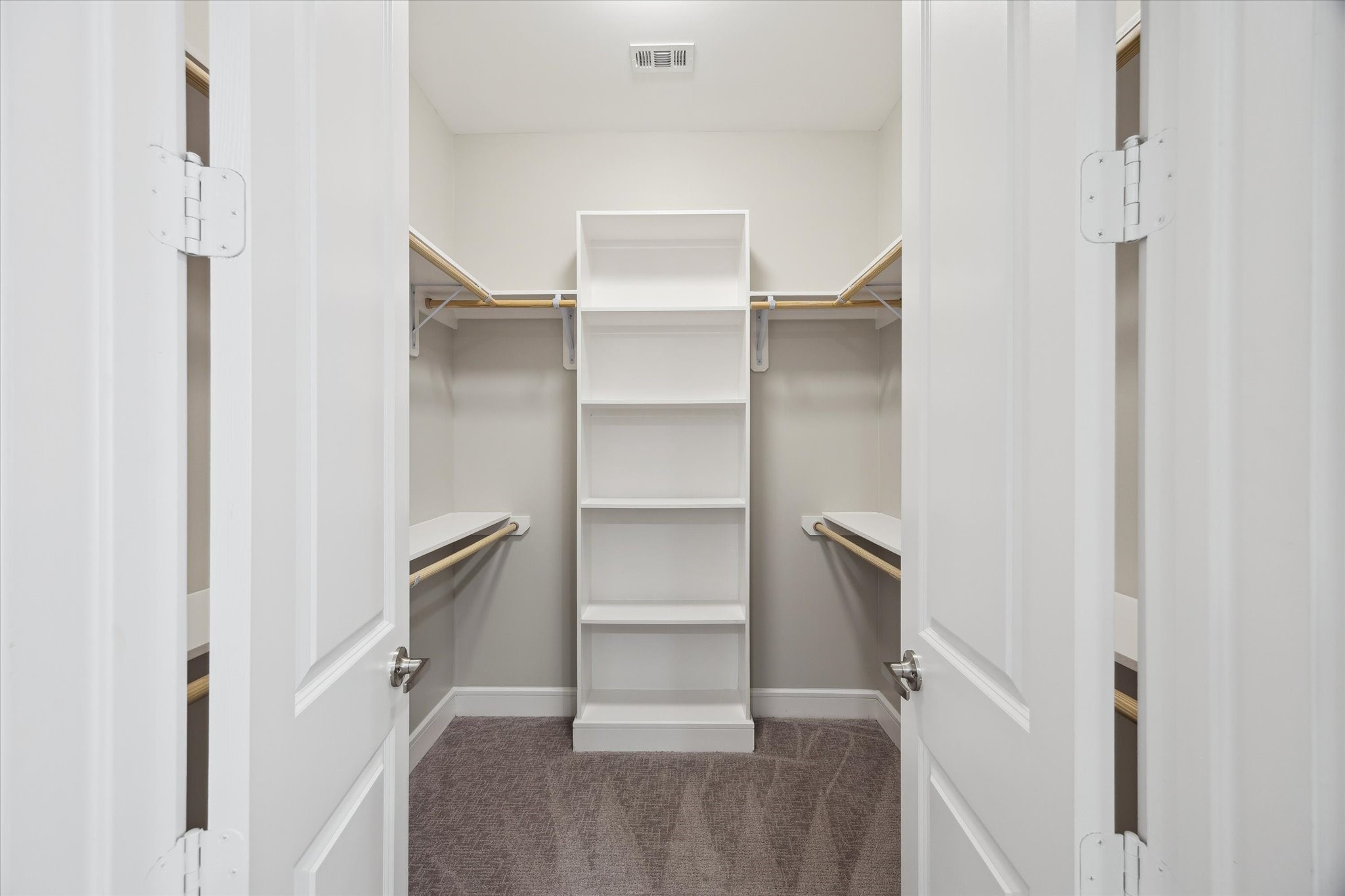 9757 Katy Freeway, Unit 822 Houston, TX 77024 - Photo 16 of 30 a view of walk in closet with empty racks