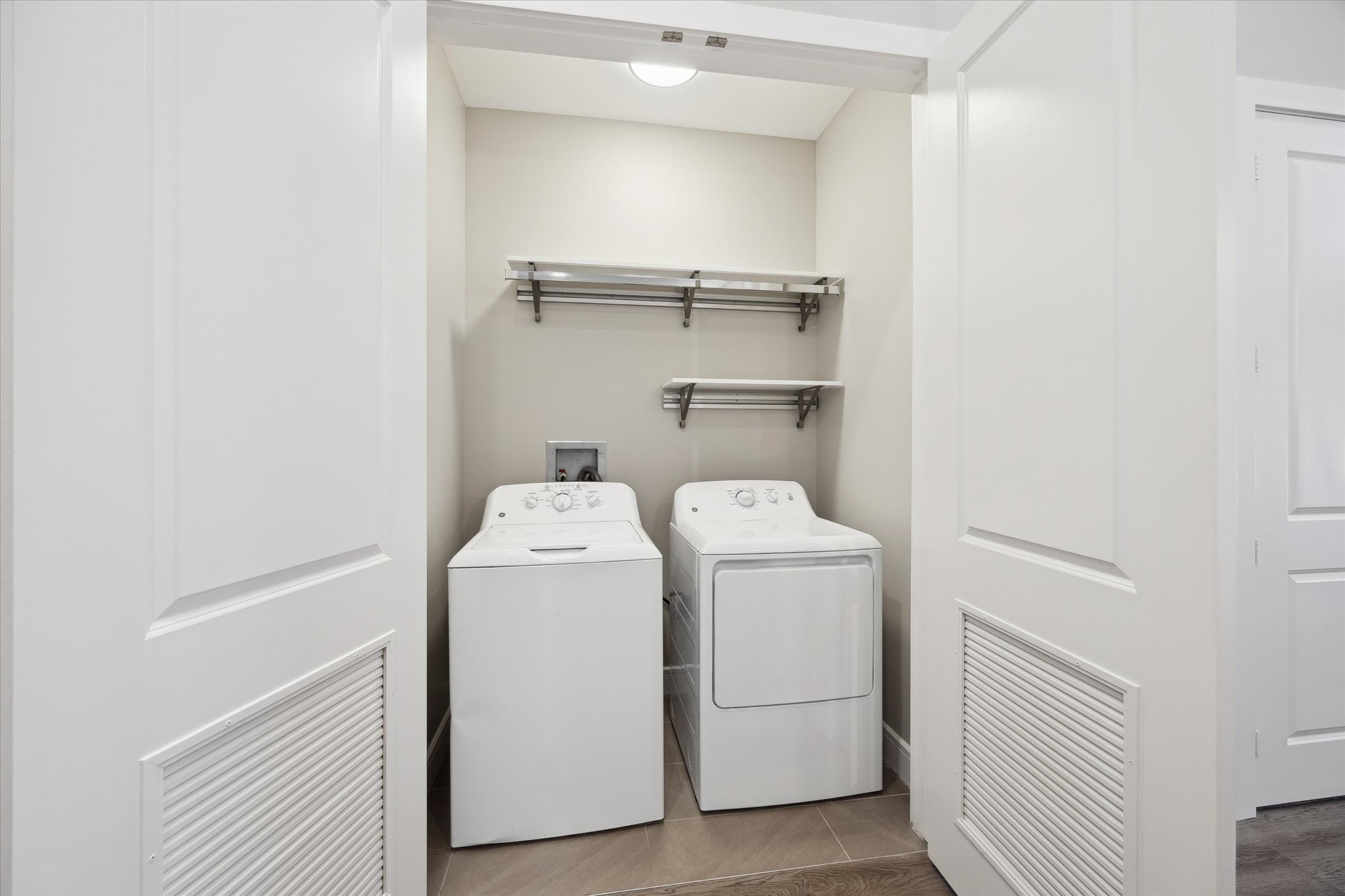 9757 Katy Freeway, Unit 822 Houston, TX 77024 - Photo 17 of 30 a utility room with dryer and washer