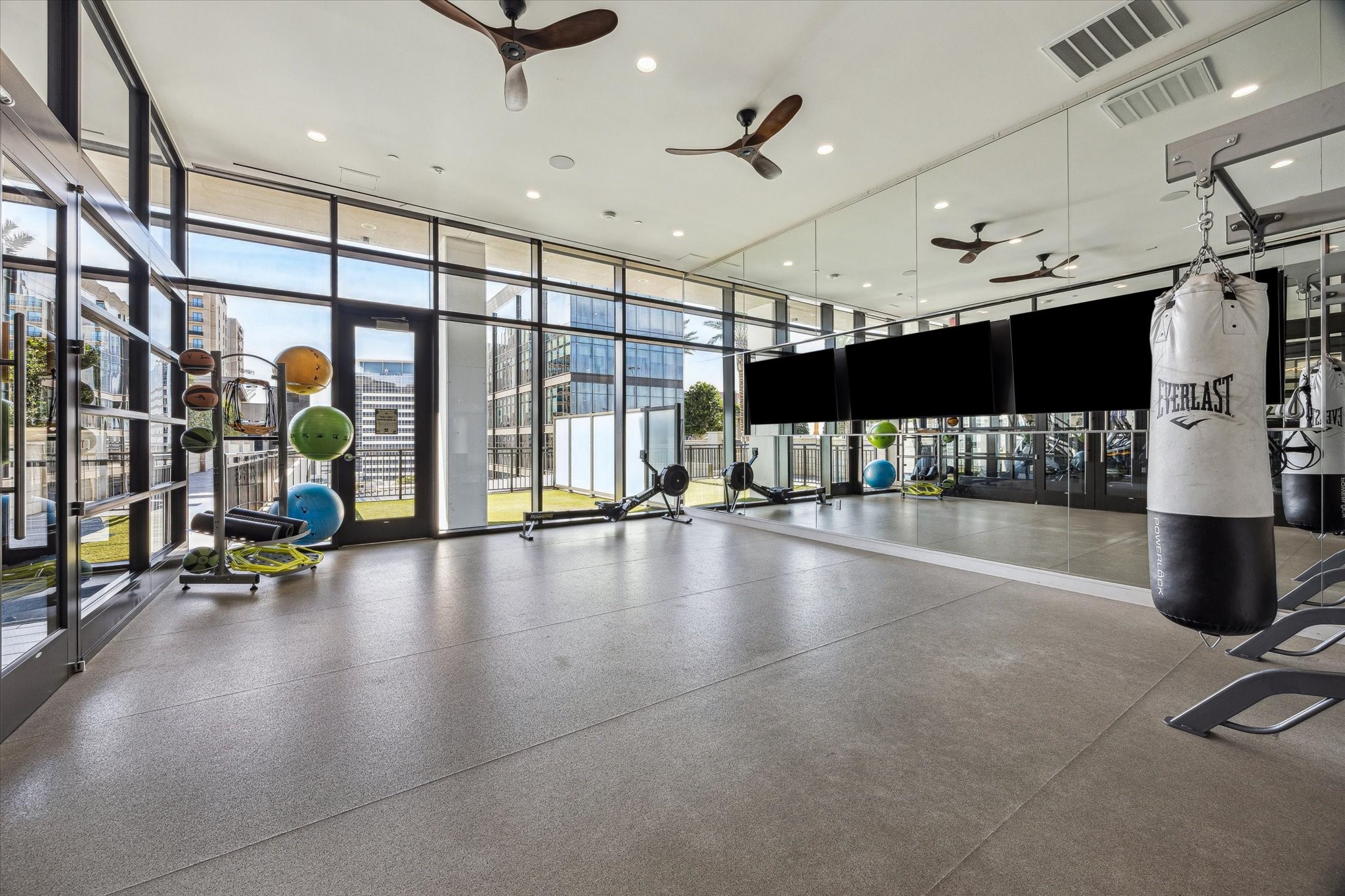 9757 Katy Freeway, Unit 822 Houston, TX 77024 - Photo 22 of 30 a view of a gym room with gym equipment