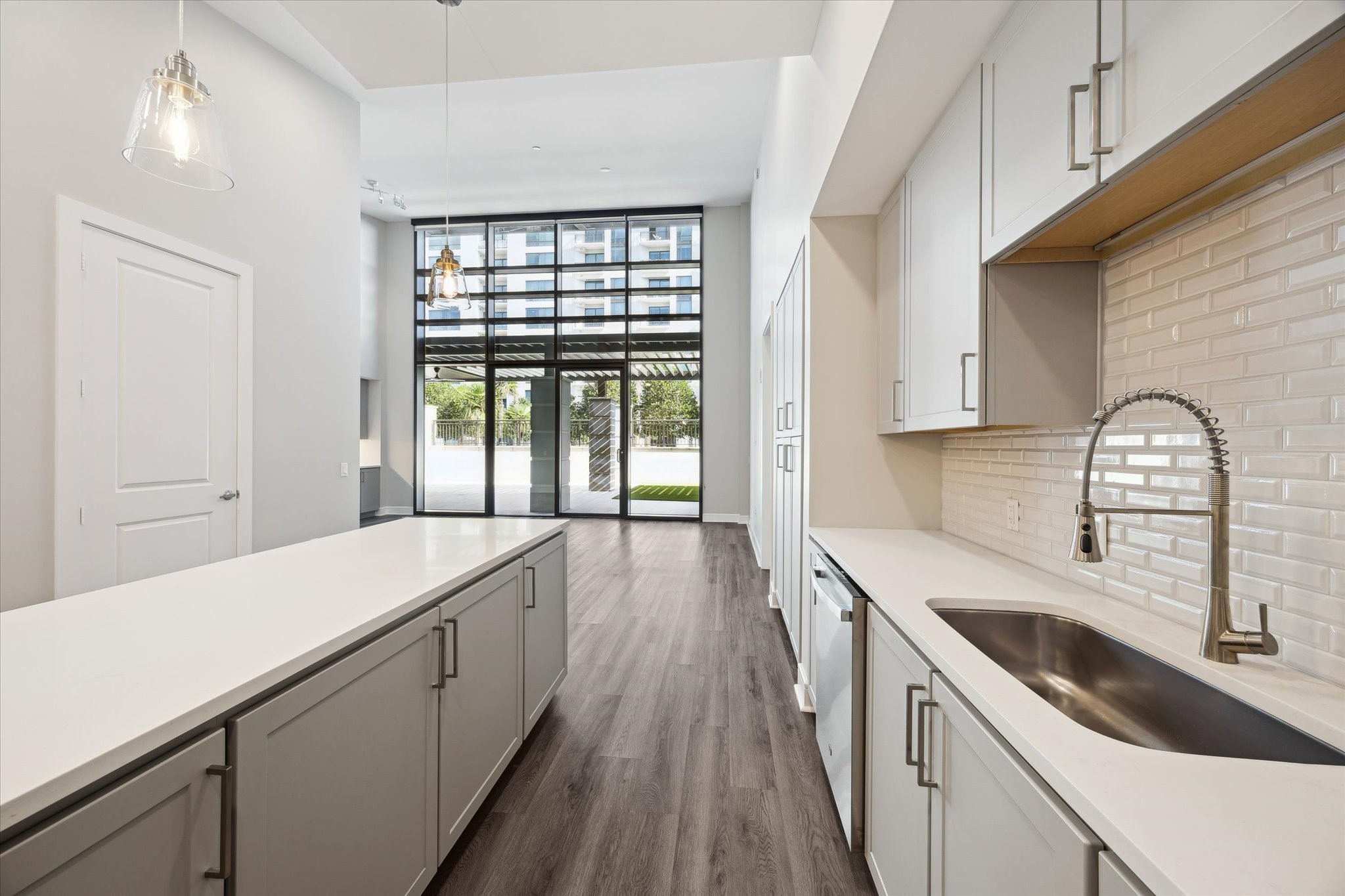 9757 Katy Freeway, Unit 822 Houston, TX 77024 - Photo 4 of 30 a kitchen with a sink and wooden floor