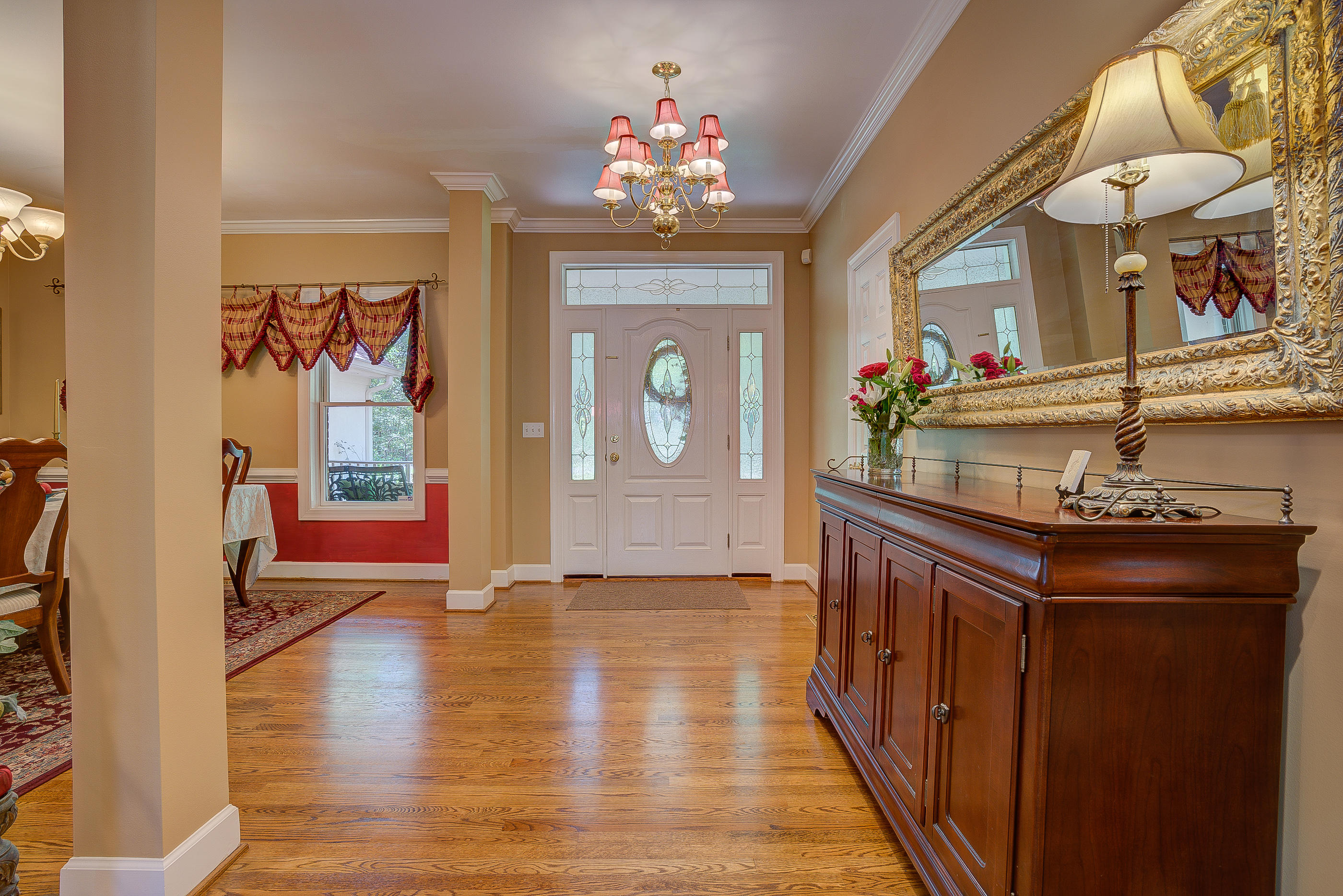 2700 New Ridge Road Elliston, VA 24087 - Photo 5 of 27 a hallway with wooden floor and chandelier