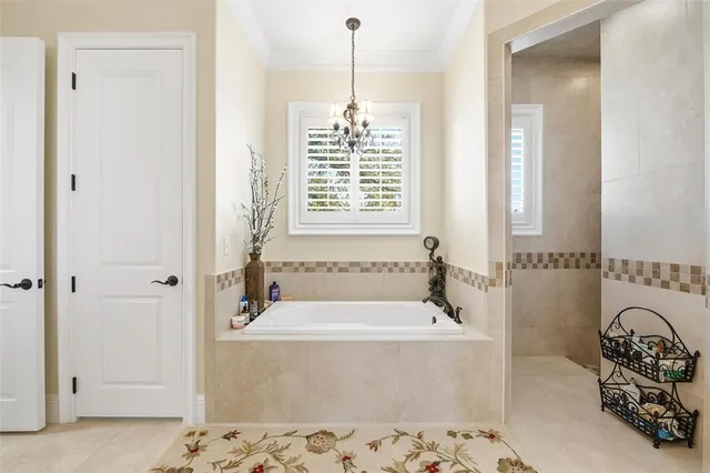 a bath room with a bath tub and a shower