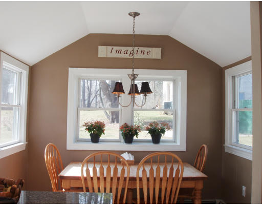 245 First Parish Road Scituate, MA 02066 - Photo 4 of 19 a view of a dining room with furniture wooden floor and a chandelier