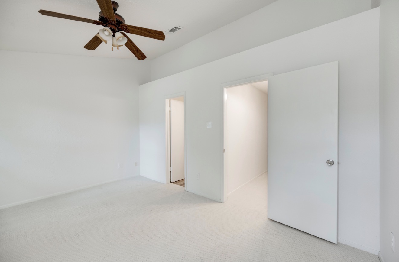 11821 Bittern Hollow, Unit 34 Austin, TX 78758 - Photo 20 of 29 Spare room with carpet and a ceiling fan