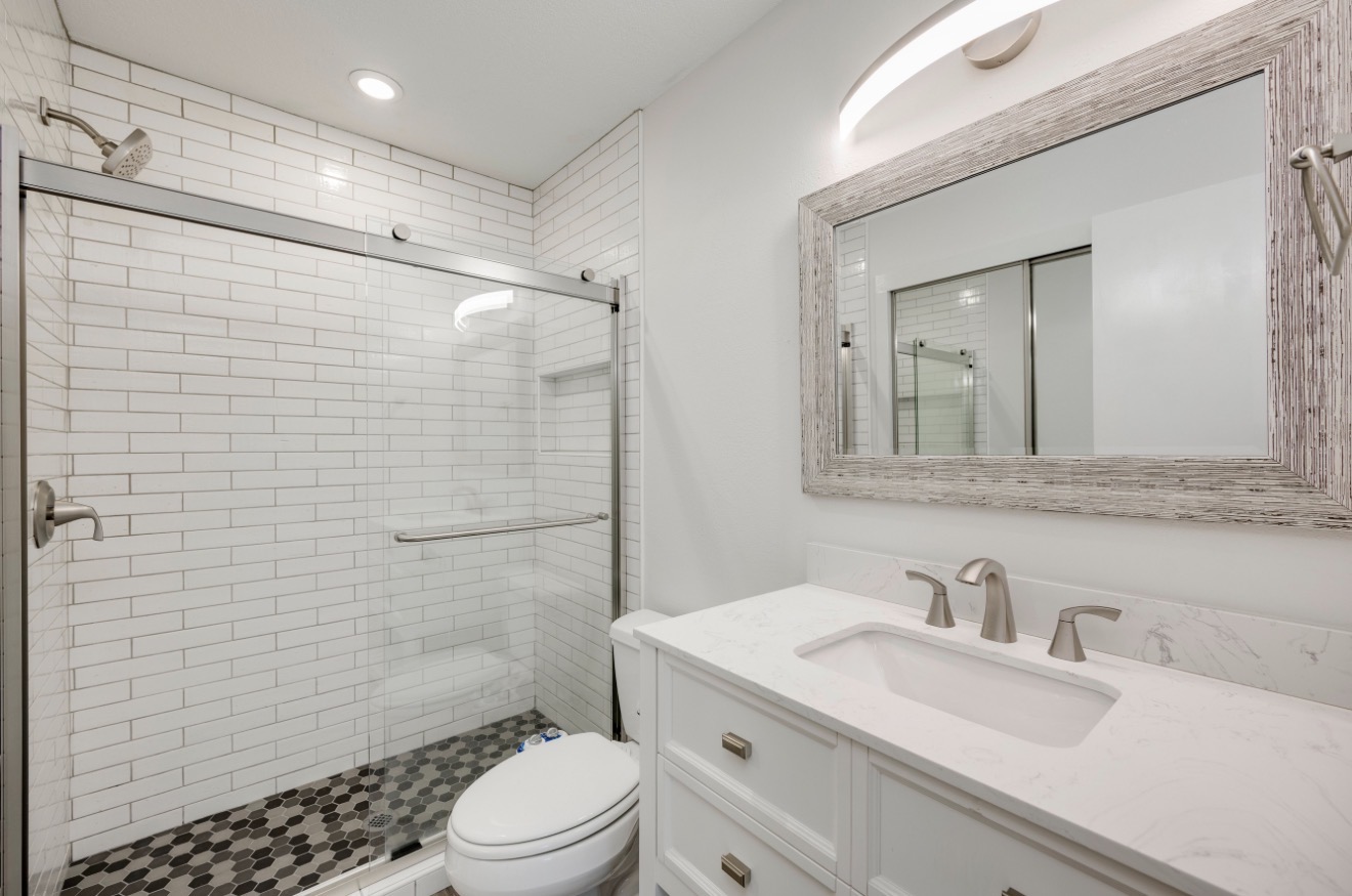 11821 Bittern Hollow, Unit 34 Austin, TX 78758 - Photo 21 of 29 Bathroom with vanity, a stall shower, and recessed lighting