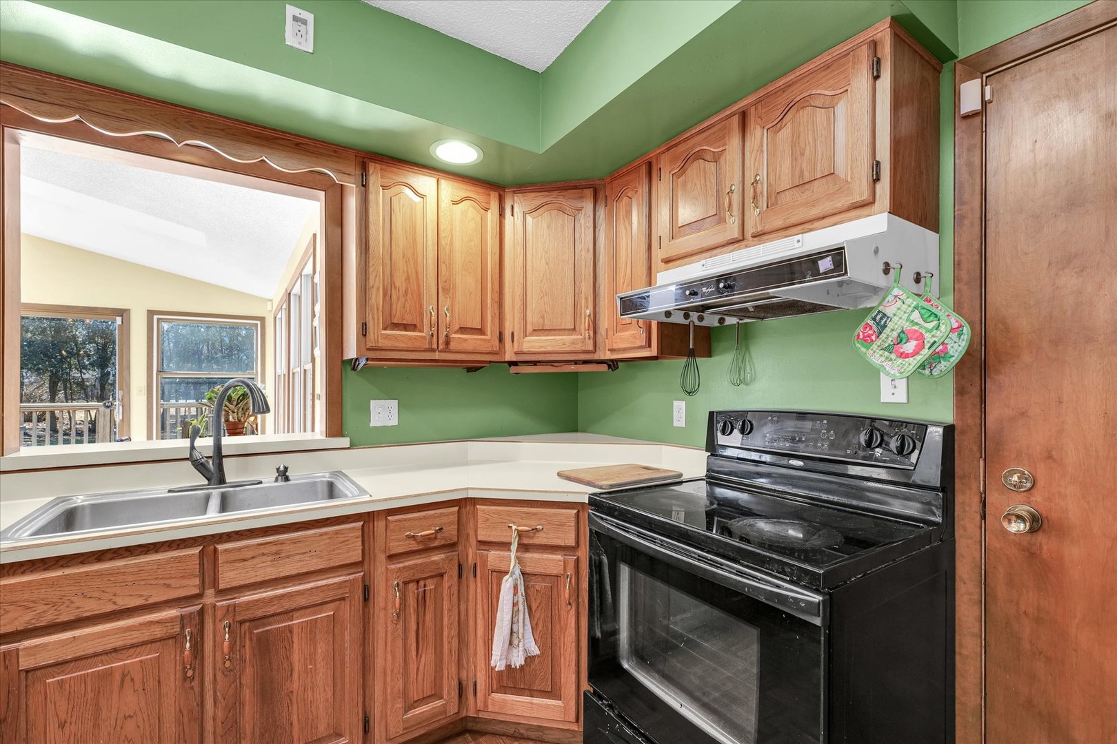 586 Hazelcrest Place Rantoul, IL 61866 - Photo 15 of 47 a kitchen with stainless steel appliances granite countertop a sink and a window
