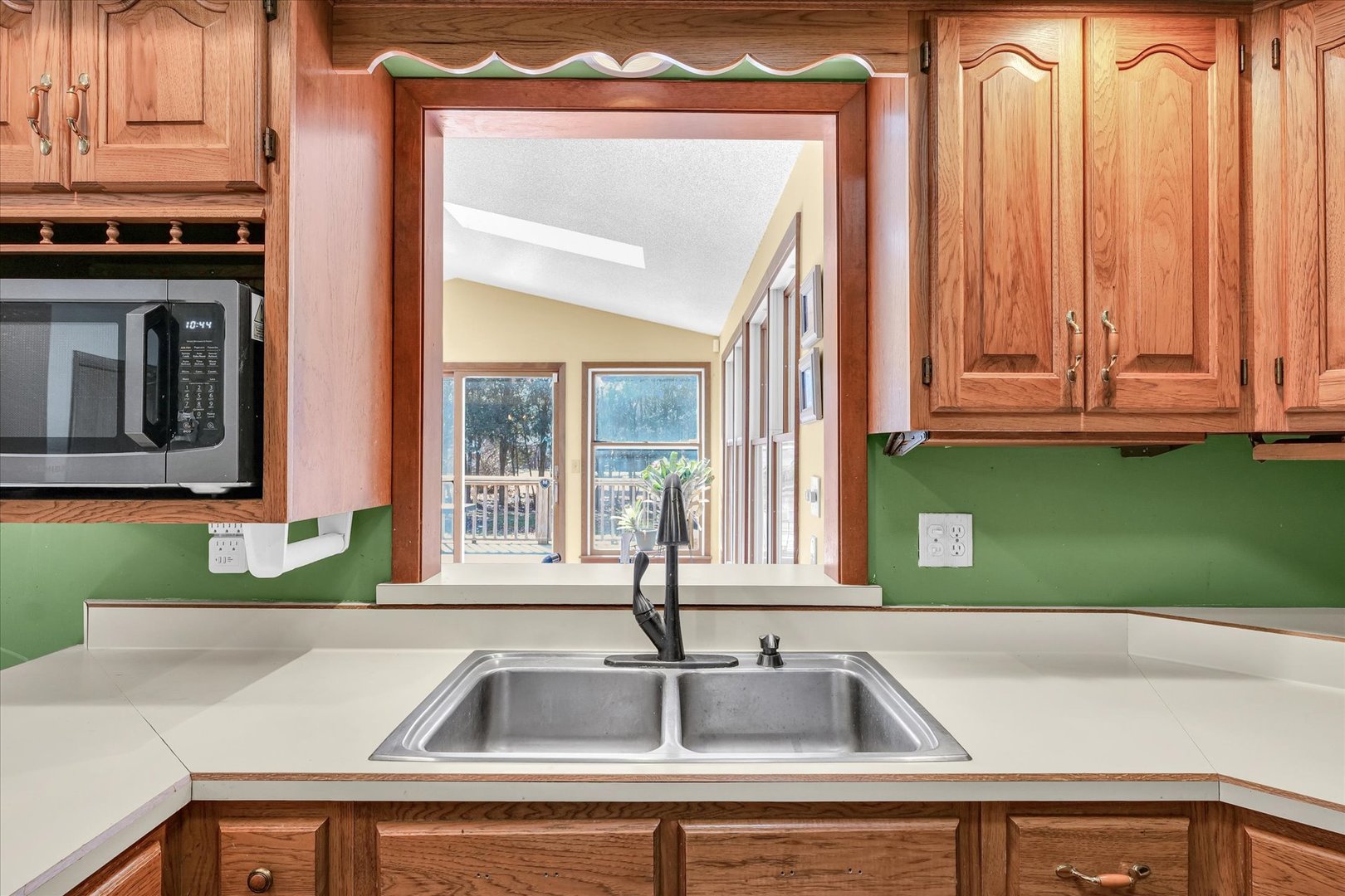 586 Hazelcrest Place Rantoul, IL 61866 - Photo 16 of 47 a view of a kitchen sink and a window