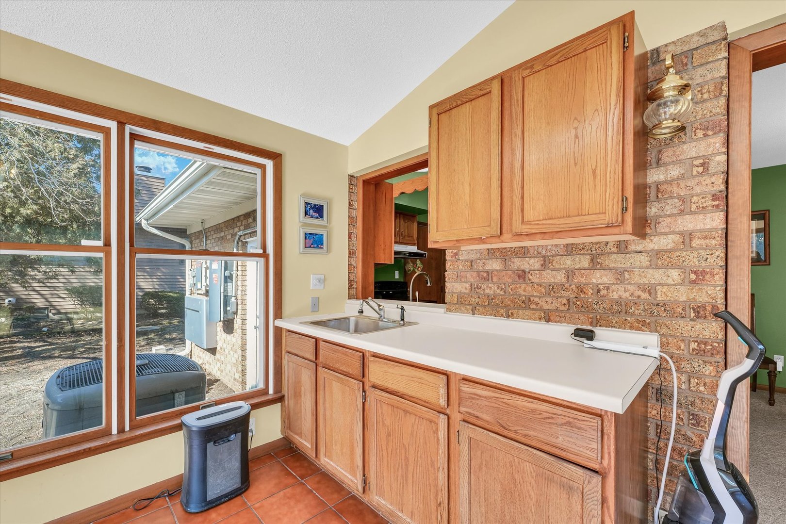 586 Hazelcrest Place Rantoul, IL 61866 - Photo 20 of 47 a kitchen that has a sink and a view of living room