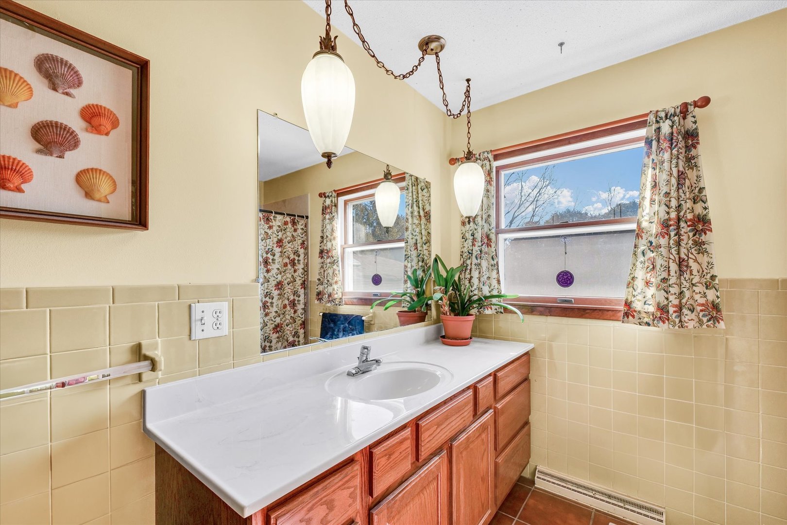 586 Hazelcrest Place Rantoul, IL 61866 - Photo 22 of 47 a bathroom with a sink a mirror and a shower