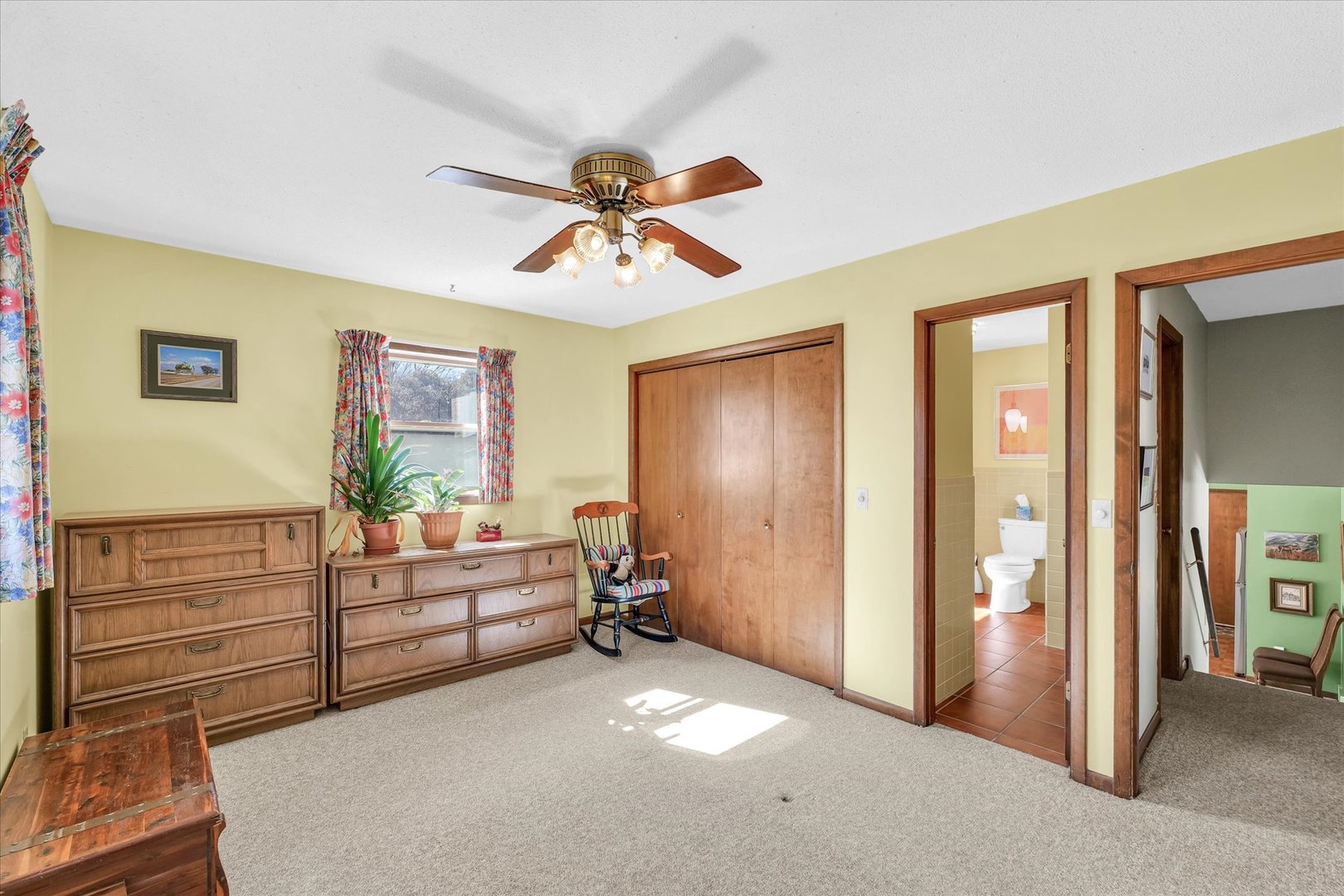586 Hazelcrest Place Rantoul, IL 61866 - Photo 25 of 47 a view of a livingroom with hardwood floor and a ceiling fan