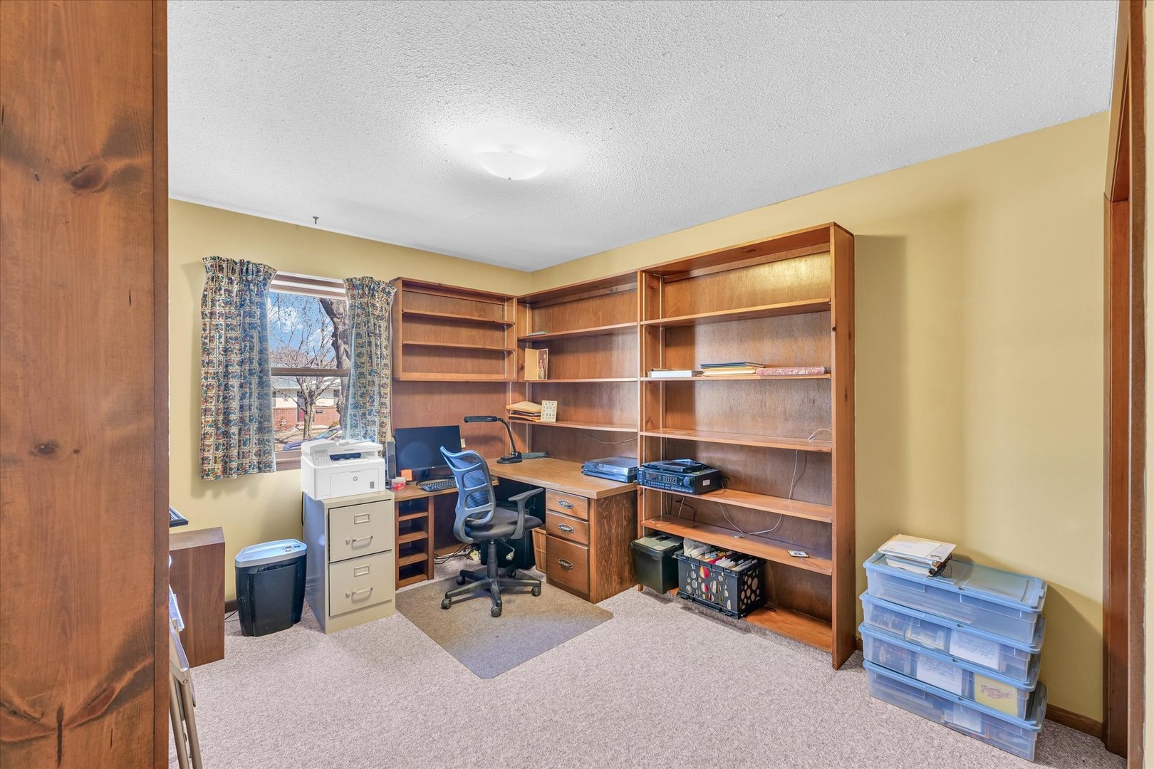 586 Hazelcrest Place Rantoul, IL 61866 - Photo 27 of 47 a view of a livingroom with workspace and a window