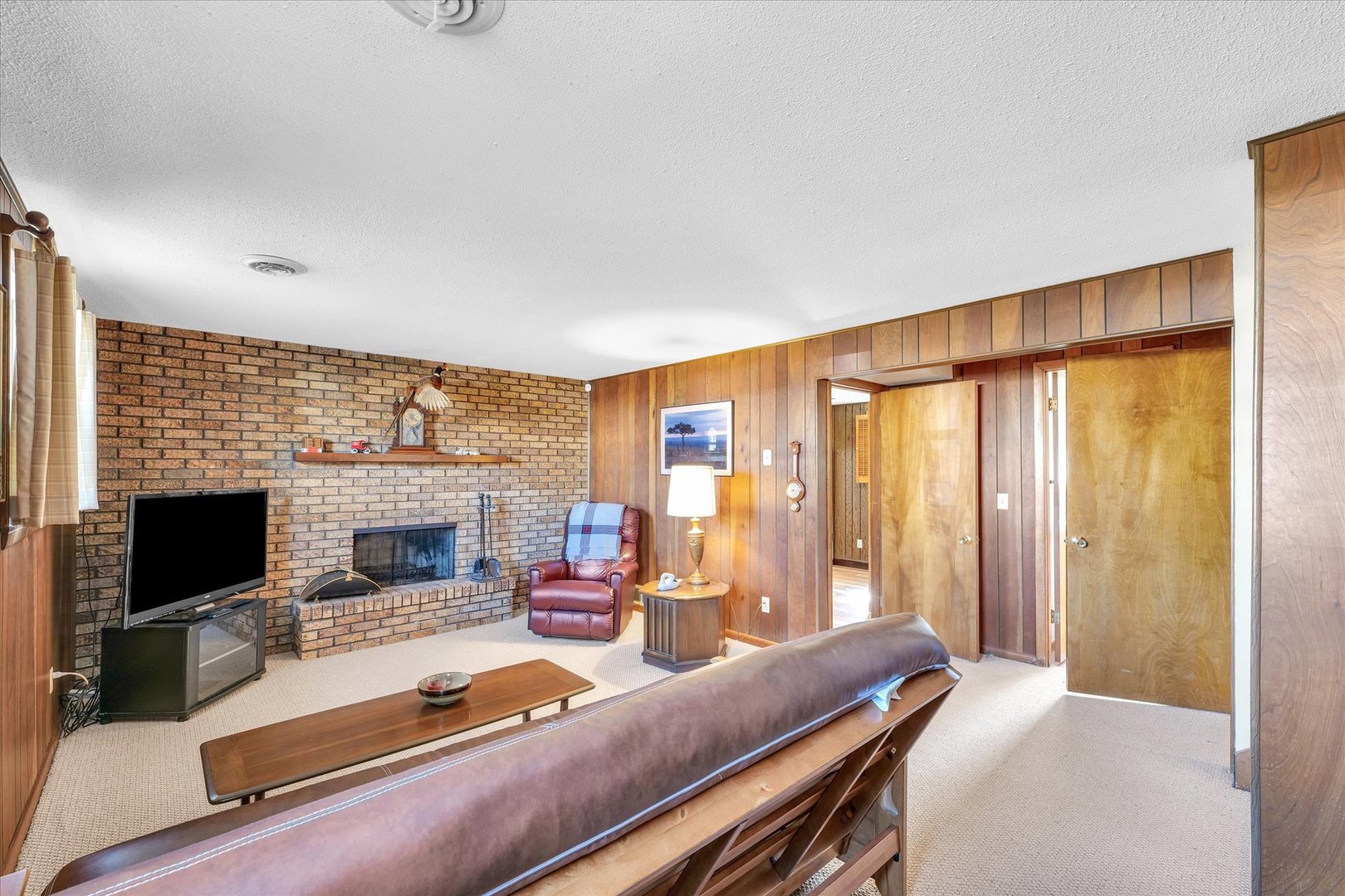 586 Hazelcrest Place Rantoul, IL 61866 - Photo 31 of 47 a living room with furniture fireplace and flat screen tv