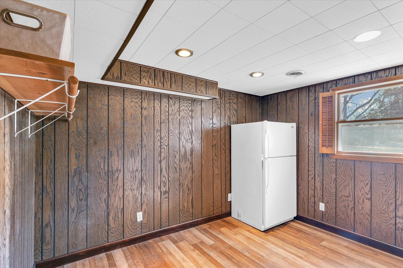586 Hazelcrest Place Rantoul, IL 61866 - Photo 35 of 47 a view of a refrigerator in kitchen and wooden floor
