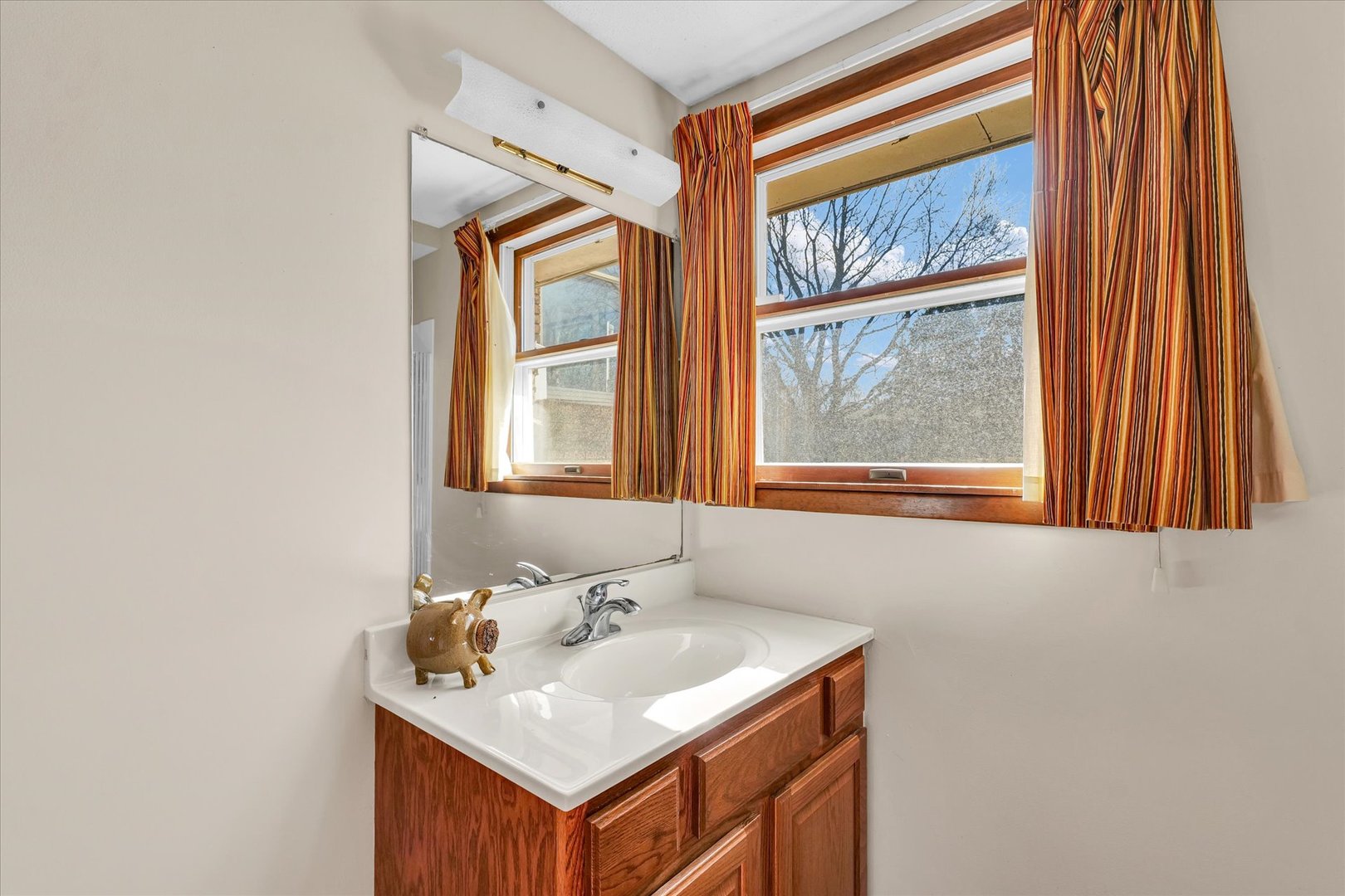 586 Hazelcrest Place Rantoul, IL 61866 - Photo 38 of 47 a bathroom with a sink a vanity and a window