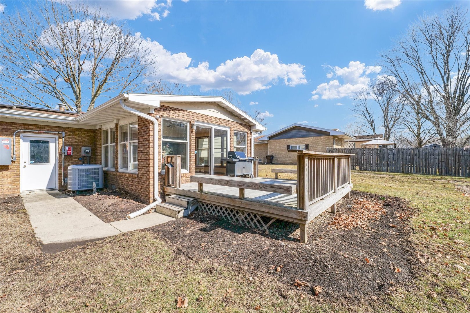 586 Hazelcrest Place Rantoul, IL 61866 - Photo 45 of 47 a view of a house with a yard and wooden fence