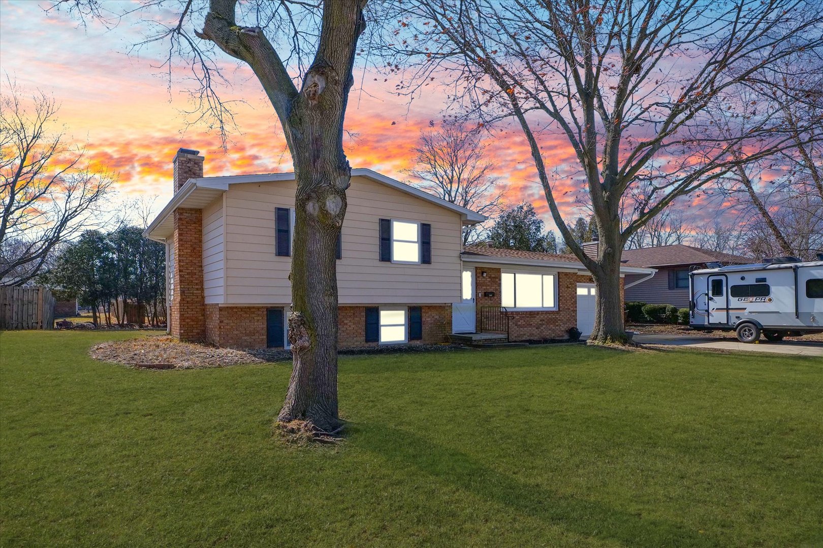 586 Hazelcrest Place Rantoul, IL 61866 - Photo 5 of 47 a front view of a house with a garden