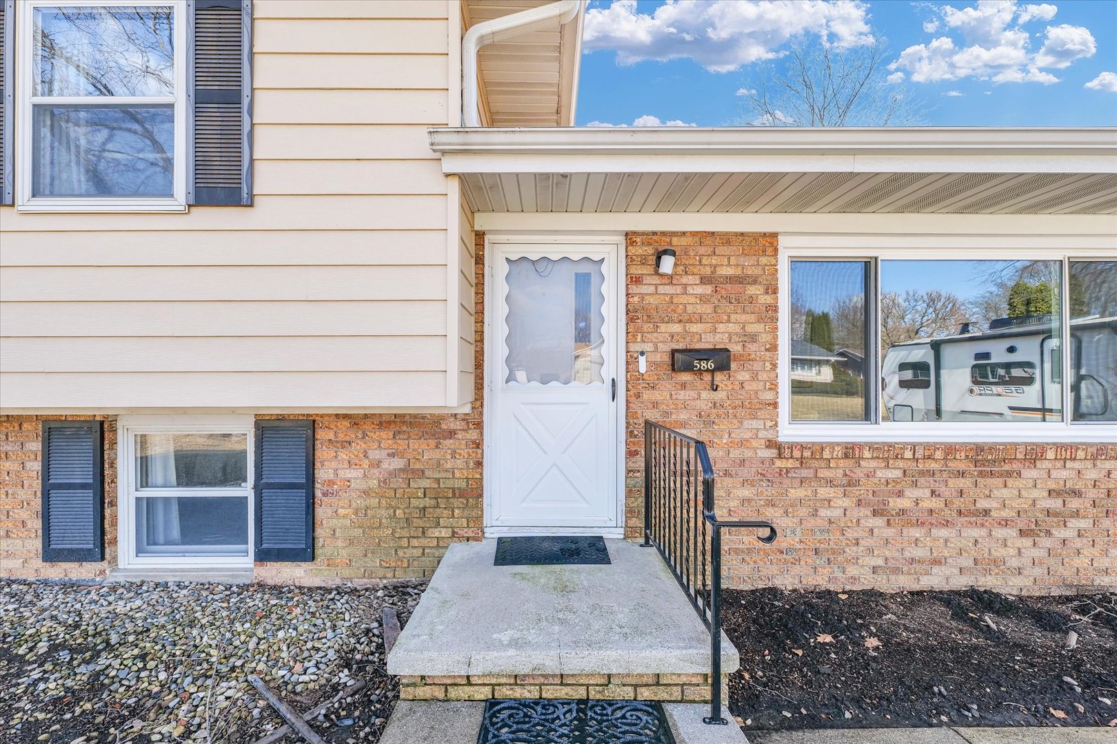 586 Hazelcrest Place Rantoul, IL 61866 - Photo 7 of 47 a front view of a house with a porch