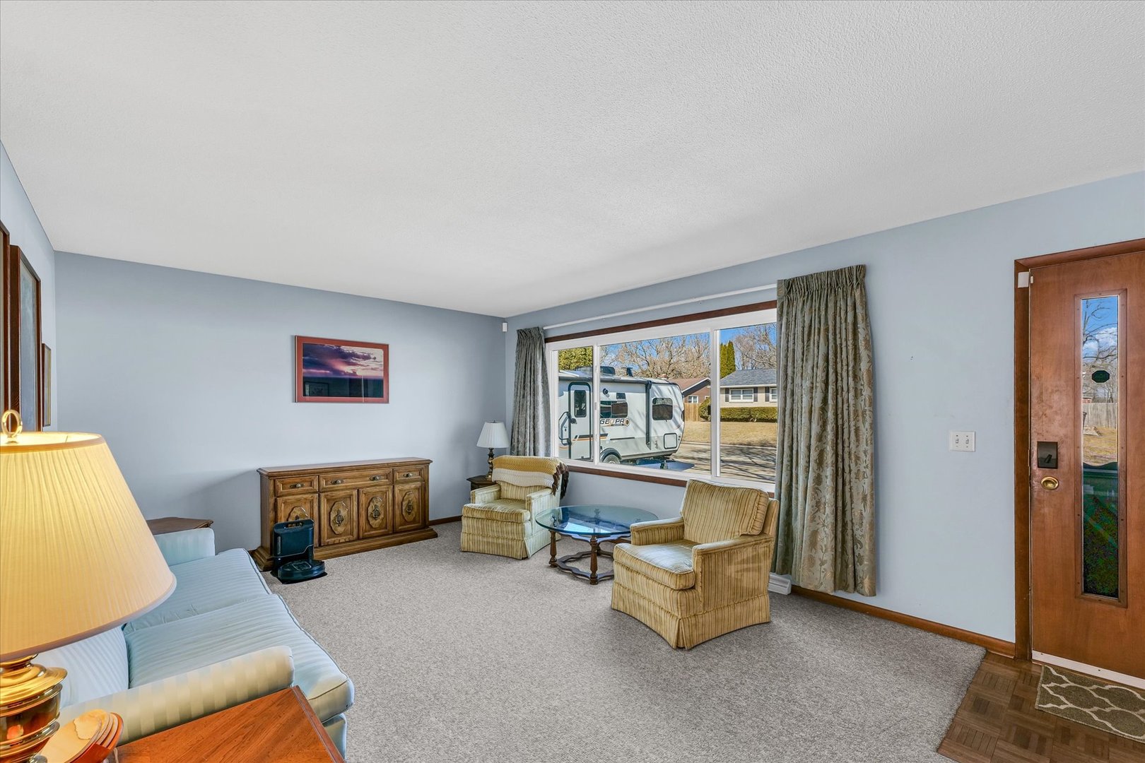 586 Hazelcrest Place Rantoul, IL 61866 - Photo 9 of 47 a living room with furniture and a window