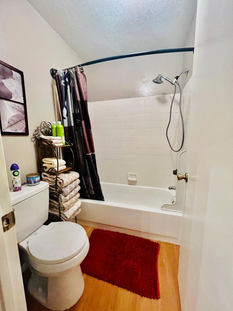 2600 South White Mountain Road Show Low, AZ 85901 - Photo 14 of 23 a bathroom with a sink a toilet and shower