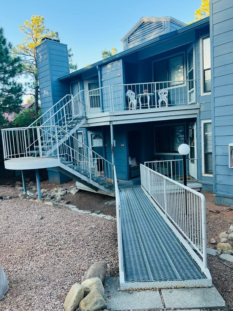 2600 South White Mountain Road Show Low, AZ 85901 - Photo 23 of 23 a view of a deck with furniture and trees