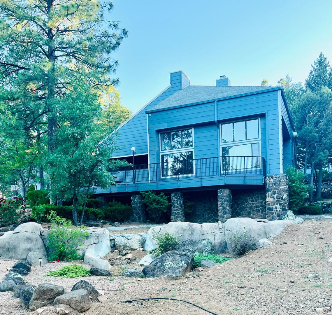 2600 South White Mountain Road Show Low, AZ 85901 - Photo 3 of 23 a front view of a house with a yard