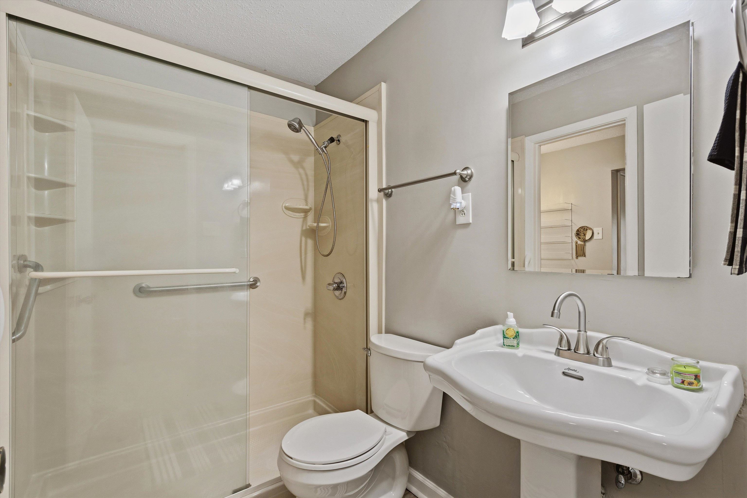 1906 Allenby Road, Unit 16 Germantown, TN 38139 - Photo 21 of 31 Shower enclosure with clear glass door and built-in shelving