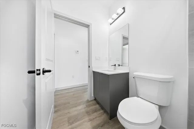 a white toilet sitting next to a bathroom sink