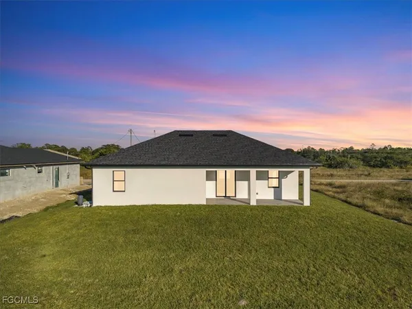 a front view of a house with a yard