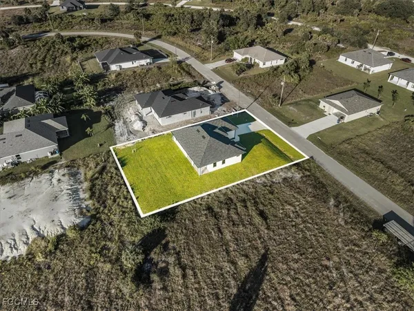 an aerial view of residential building with parking space