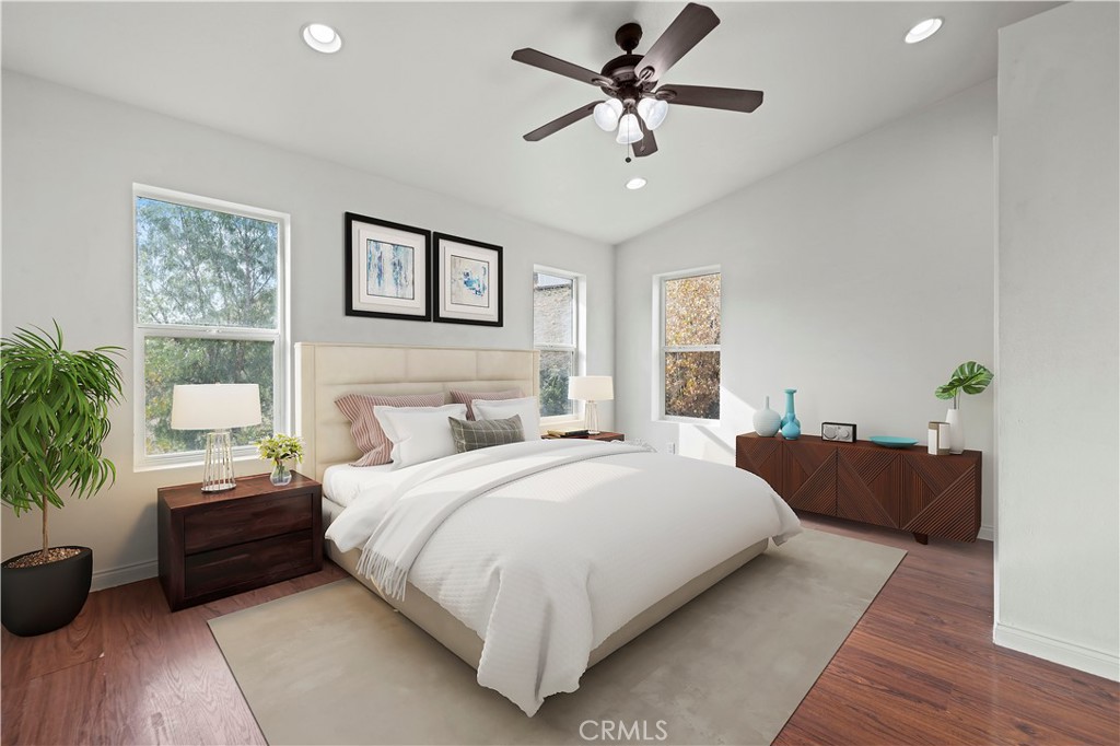 28637 Chiquito Canyon Road Castaic, CA 91384 - Photo 25 of 74 a bedroom with a large bed and a potted plant