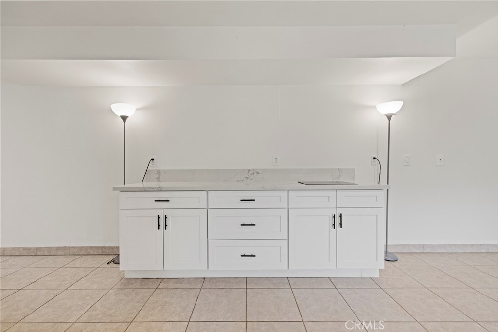 28637 Chiquito Canyon Road Castaic, CA 91384 - Photo 38 of 74 a view of a kitchen with white cabinets