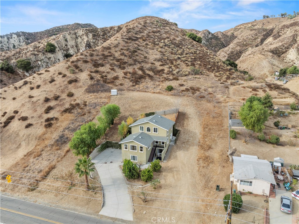 28637 Chiquito Canyon Road Castaic, CA 91384 - Photo 64 of 74 an aerial view of a house with a mountain