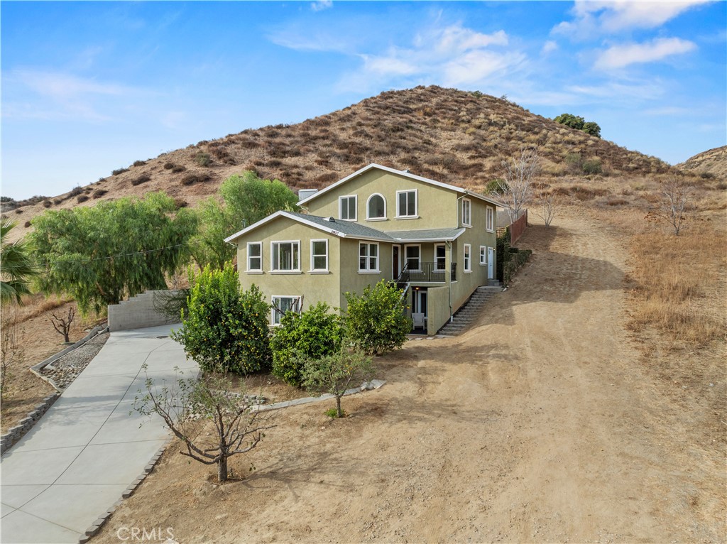 28637 Chiquito Canyon Road Castaic, CA 91384 - Photo 68 of 74 a front view of a house with a yard