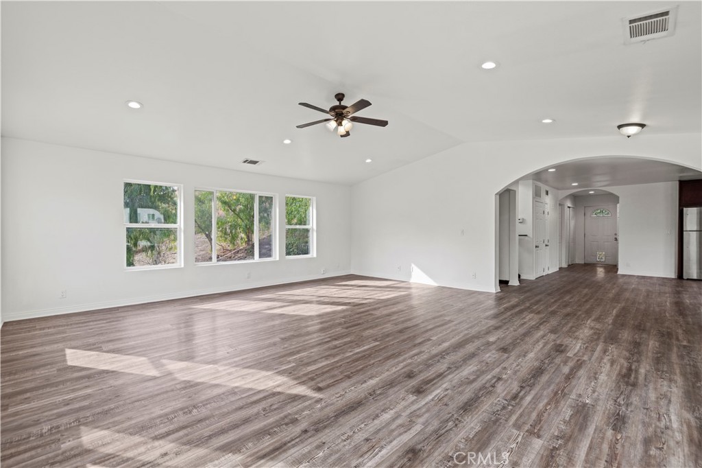 28637 Chiquito Canyon Road Castaic, CA 91384 - Photo 7 of 74 wooden floor in an empty room with a window