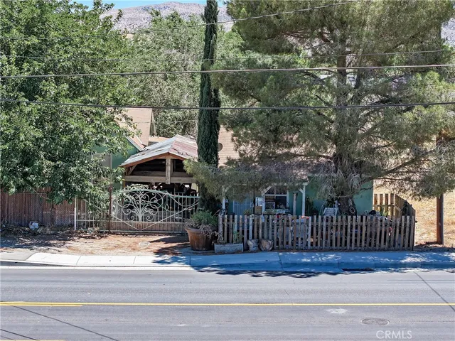 a view of a yard and front view of a house
