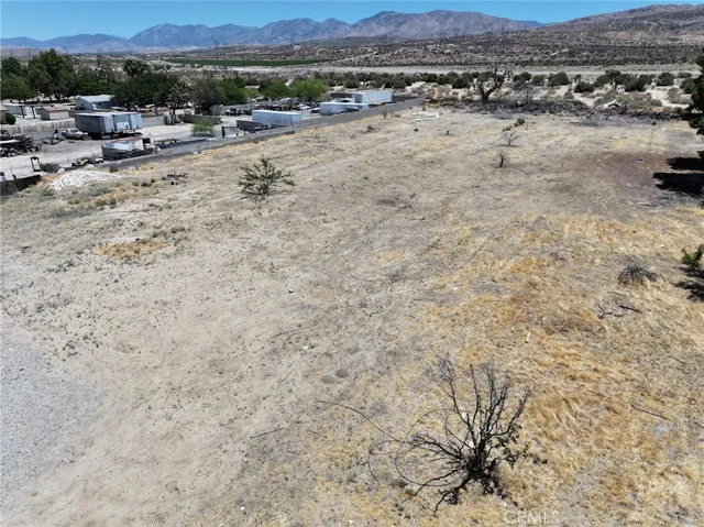a view of a beach with a mountain