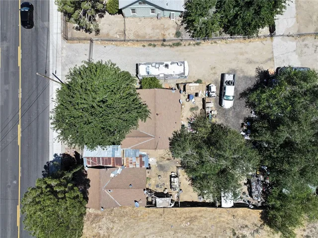 an aerial view of a house with outdoor space