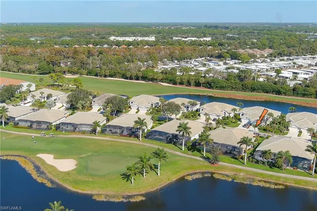 an aerial view of a house with a ocean view