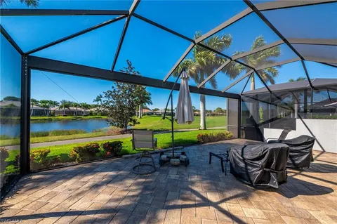 a view of a chairs and table in the patio
